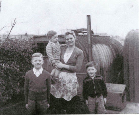 Mrs-Partington-holding-nephew-Dennis-Tommy-Carroll