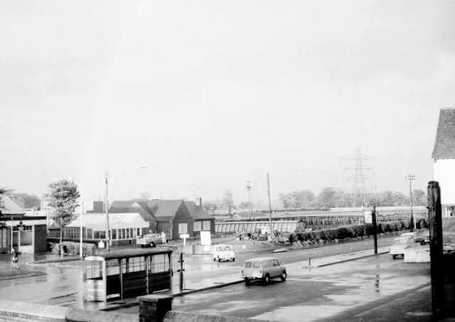 FLower-gardens-opposite-bridge-inn-Pressworks-garage