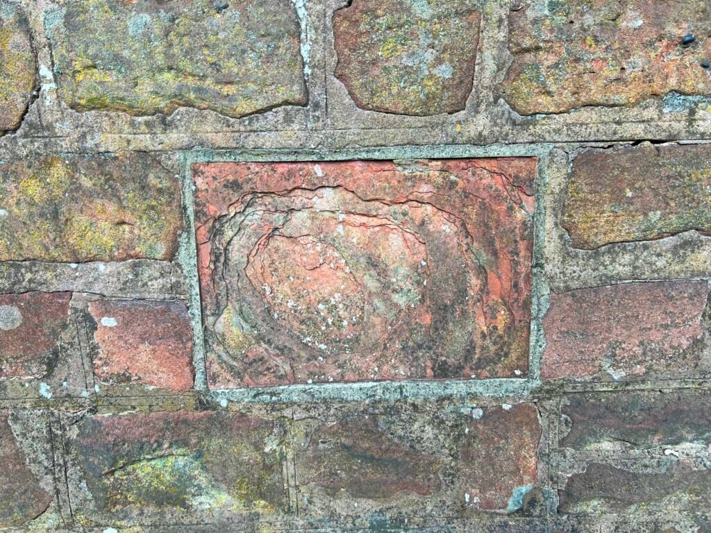 The datestone has now been damaged, likely by a freeze, thaw cycle